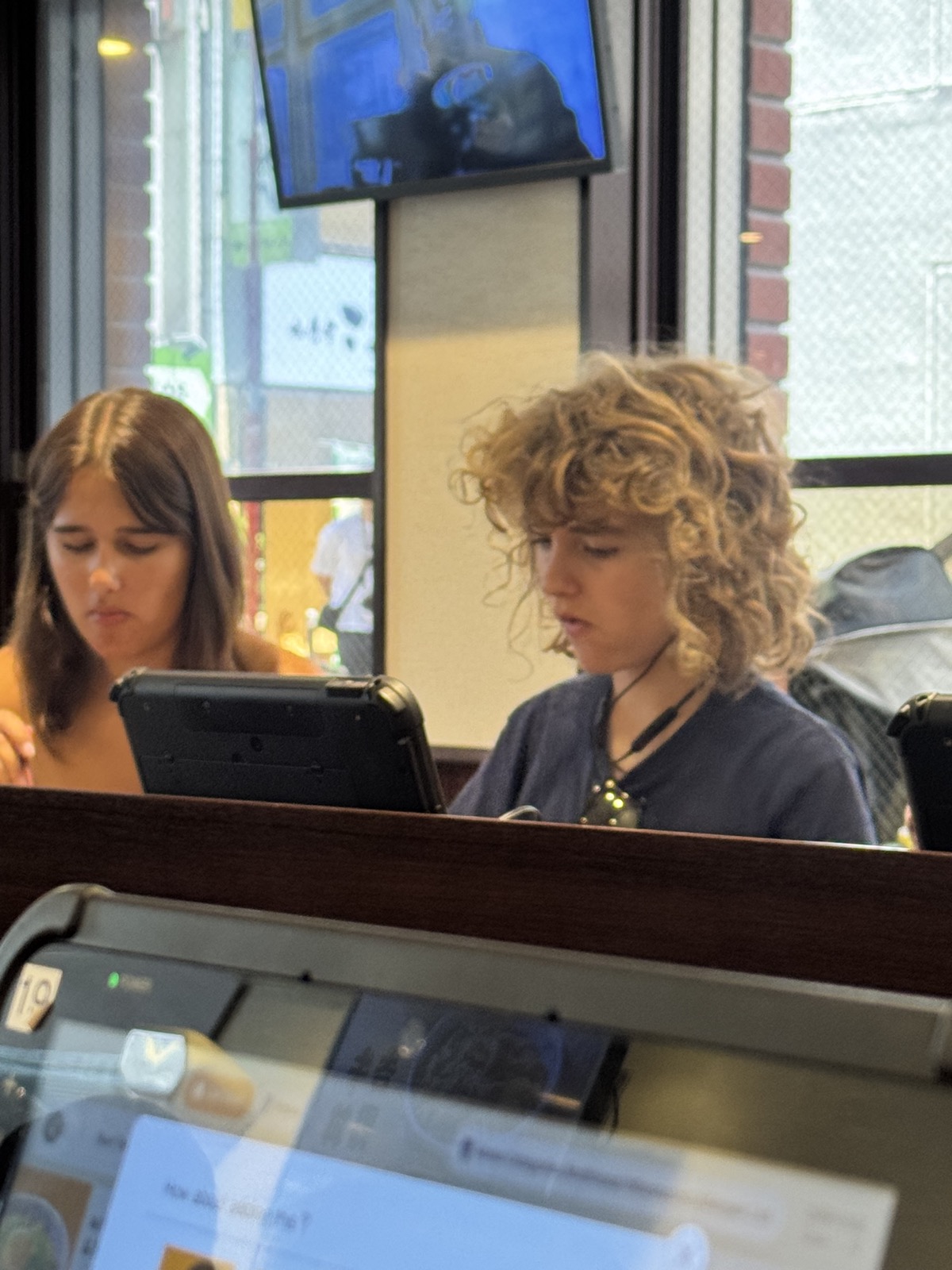 Seraphima and Luca ordering lunch on tablets at Yoshinoya, Ochanomizu
